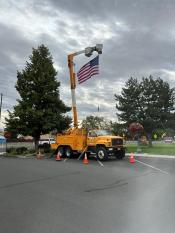 American Flag and Line Truck
